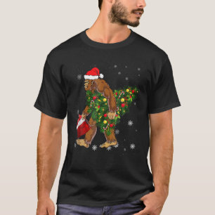 Bigfoot Carrying Christmas Tree Sasquatch Believer T-Shirt