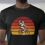 Bigfoot Cycling Retro sunset Silhouette for Bikers T-Shirt<br><div class="desc">Unleash your adventurous spirit with this whimsical design featuring Bigfoot riding a bike against a retro sunset backdrop. Perfect for cycling enthusiasts and myth lovers alike, this unique illustration captures the essence of fun and mystery. Whether you're hitting the trails or enjoying a casual day out, this graphic is sure...</div>