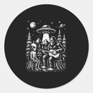 Bigfoot playing guitar with alien and ufo classic round sticker