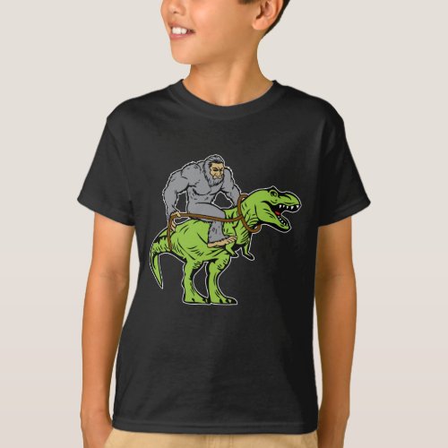Bigfoot Sasquatch Riding Dinosaur T rex T_Shirt