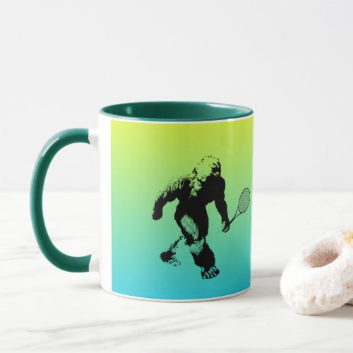 Bigfoot Tennis Player With Text on Blue and Yellow Mug