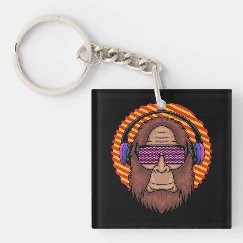 bigfoot wearing a techno eyeglasses and headphone keychain