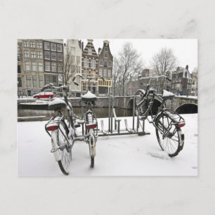 Bikes in snowy Amsterdam in the Netherlands Postcard