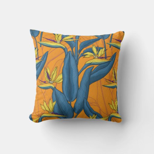 Bird of paradise flowers on orange throw pillow