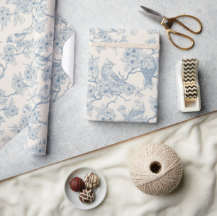 Birds and cherry blossom in blue and off white wrapping paper