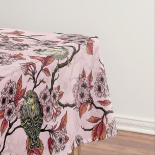 Birds and cherry blossom on rose pink tablecloth