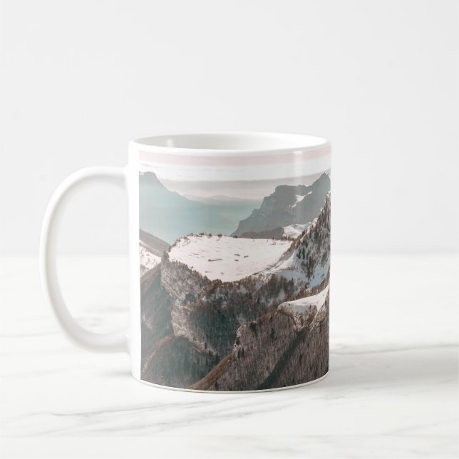 BIRD'S-EYE VIEW OF SNOW COVERED MOUNTAIN UNDER CLE COFFEE MUG (Left)