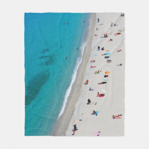 Bird's eye view photo of people on beach fleece blanket