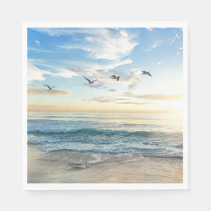 Birds in flight over the ocean napkins