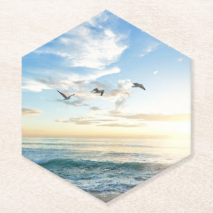 Birds in flight over the ocean paper coaster