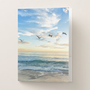 Birds in flight over the ocean pocket folder
