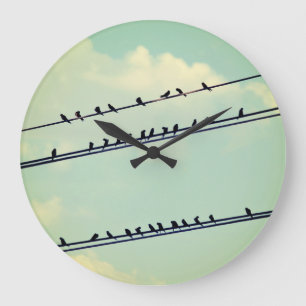 Birds on wires, vintage blue sky. large clock