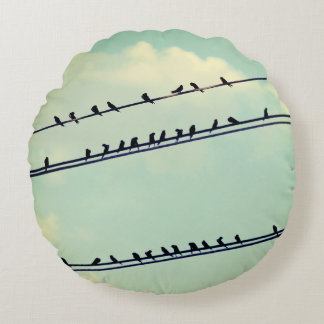 Birds on wires, vintage blue sky. round pillow