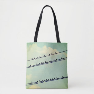 Birds on wires, vintage blue sky. tote bag