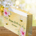 Birthday happy bumble bees honeycomb florals large gift bag<br><div class="desc">For a summer 50th (or any age) birthday party. Yellow,  white background with a honeycomb pattern. Decorated with pink colored tropical florals flowers,  hibiscus and happy bumble bees. Text: Happy Birthday.  Add a name. Green colored letters.</div>