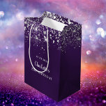 Birthday purple silver glitter dust monogram medium gift bag<br><div class="desc">A gift bag for a girly and glamorous 21st (or any age) birthday. A deep purple background decorated with faux silver glitter dust. The purple color is uneven. Personalize and add a date, name and age 21. The text: The name is written in white with a modern hand lettered style...</div>