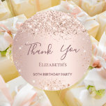 Birthday rose gold thank you classic round sticker<br><div class="desc">For a girly and glamorous 50th (or any age) birthday party.  A rose gold background. Personalize and add a name and age 50. With the text: Thank You written with a modern hand lettered style script.</div>