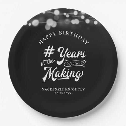 Birthday String Light YEARS IN THE MAKING Black Paper Plates - Celebrate any age birthday for him or her with these personalized black and white party plates featuring a calligraphy script typography title design # YEARS IN THE MAKING that incorporates their age and birth year within the design, the editable title HAPPY BIRTHDAY and name and date or other custom text with a border of string lights. Contact the designer via Zazzle Chat or makeitaboutyoustore@gmail.com if you'd like this design modified, in another color, on another product or would like coordinating items.