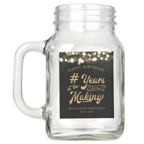 Birthday String Light YEARS IN THE MAKING Mason Jar - Celebrate any age birthday for him or her with these personalized black and gold mason jar featuring a calligraphy script typography title design # YEARS IN THE MAKING that incorporates their age and birth year within the design, the editable title HAPPY BIRTHDAY and name and date or other custom text with a border of string lights. Contact the designer via Zazzle Chat or makeitaboutyoustore@gmail.com if you'd like this design modified, in another color, on another product or would like coordinating items.