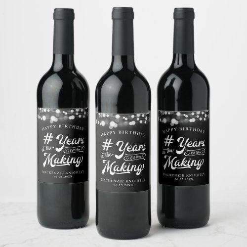 Birthday String Light YEARS IN THE MAKING Wine Label - Celebrate any year birthday with these personalized black and white wine and beverage label featuring a calligraphy script typography title design # YEARS IN THE MAKING that incorporates their birth year within the design, the editable title HAPPY BIRTHDAY and name and date or other custom text with a border of string lights. Contact the designer via Zazzle Chat or makeitaboutyoustore@gmail.com if you'd like this design modified, in another color, on another product or would like coordinating items.