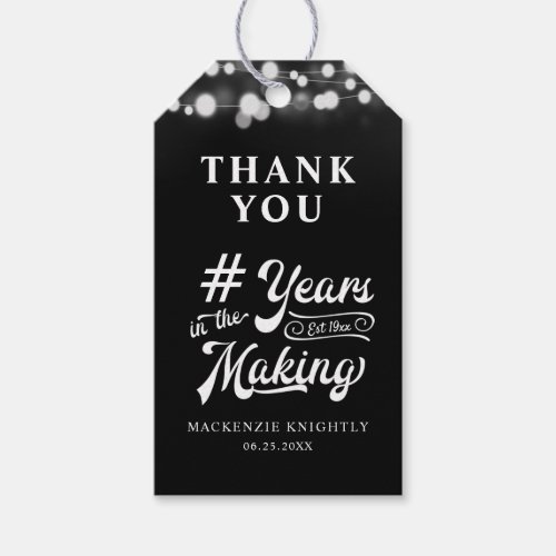 Birthday Thank You Years in the Making Lights Gift Tags - Utilize these black and white birthday thank you favor tags to thank your guests for attending any age birthday celebration for him or her. The design features a calligraphy script typography title # YEARS IN THE MAKING that incorporates their age and birth year within the design, THANK YOU and name and date or other custom text with a border of string lights. Contact the designer via Zazzle Chat or makeitaboutyoustore@gmail.com if you'd like this design modified, in another color, on another product or would like coordinating items.