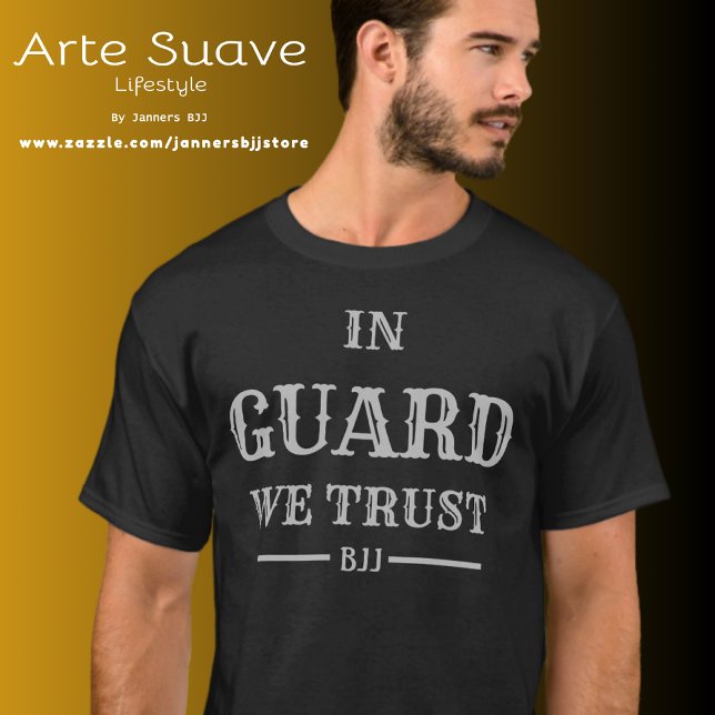 BJJ In Guard We Trust Brazilian Jiu Jitsu T-Shirt (Man wearing a black t-shirt with "In Guard We Trust" printed in vintage ornate white font.)