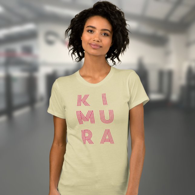 BJJ Kimura Woman's Jiu Jitsu Cream T-Shirt (Kimura BJJ t-shirt in cream worn by a female model in the gym.)