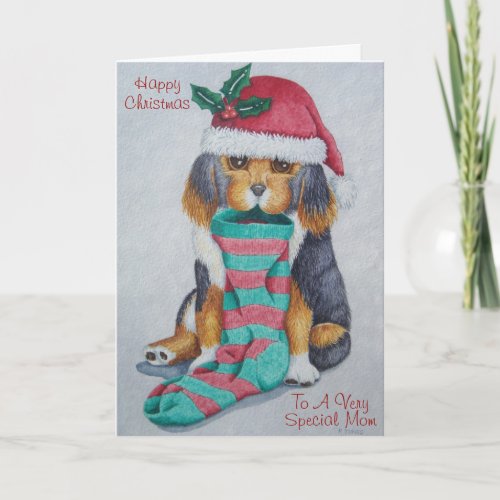 black and brown puppy with stocking for christmas holiday card