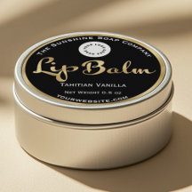 Black and gold foil lip balm label with logo.