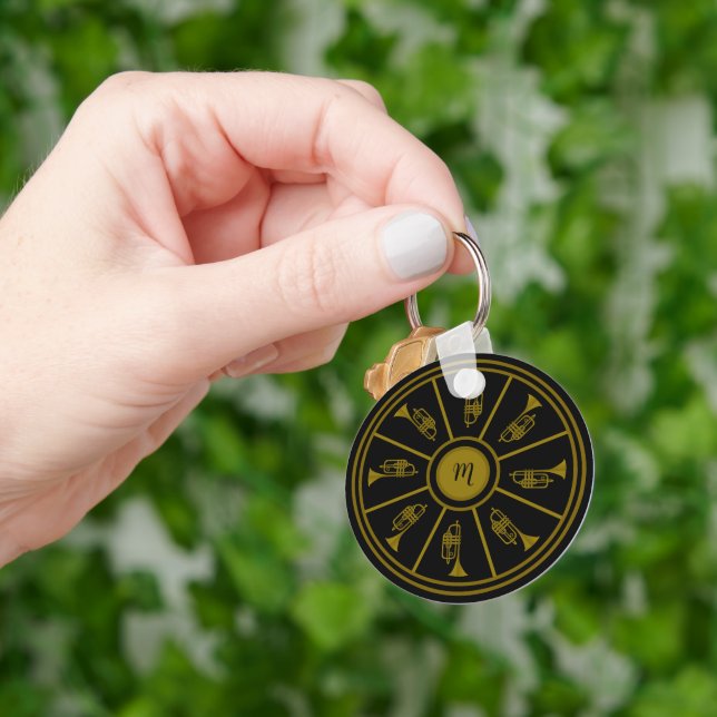 Black and gold motif with trumpets and a monogram keychain (Hand)