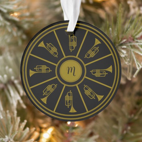Black and gold motif with trumpets and a monogram ornament