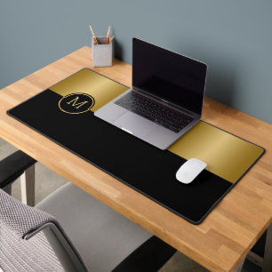 Black and gold split-screen geometric design desk mat