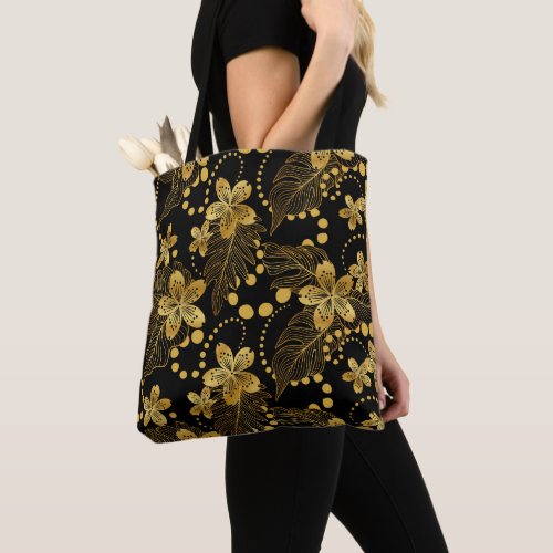 Black and gold Tropical leaves and flowers pattern Tote Bag