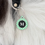 Black And Mint Green Monogram Dog Paws Pattern Pet Name Tag<br><div class="desc">This pet tag has a black circle on the middle with a personalizable monogram letter. The background color is mint green with white small dog paws pattern. On the other side there are personalizable text areas for the name of your pet and for your phone number.</div>