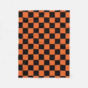 Black and orange checkered pattern fleece blanket