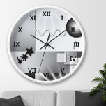 Black and White Art Deco Style Wall Clock<br><div class="desc">Wall clock with a playful geometric art deco design in black and white.</div>
