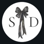 Black and White Bow Monogram Wedding Classic Round Sticker<br><div class="desc">Classic and sophisticated,  this wedding invitation suite features elegant black and white detailing with a delicate bow illustration as the focal point. The clean lines and timeless typography create a refined aesthetic,  perfect for formal or black-tie weddings. Customizable to include your wedding details,  this invitation exudes understated luxury.</div>