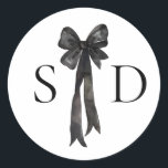Black and White Bow Monogram Wedding Classic Round Sticker<br><div class="desc">Classic and sophisticated,  this wedding invitation suite features elegant black and white detailing with a delicate bow illustration as the focal point. The clean lines and timeless typography create a refined aesthetic,  perfect for formal or black-tie weddings. Customizable to include your wedding details,  this invitation exudes understated luxury.</div>