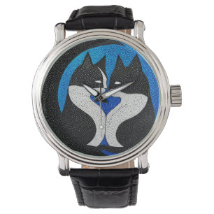 Black and white cats watch