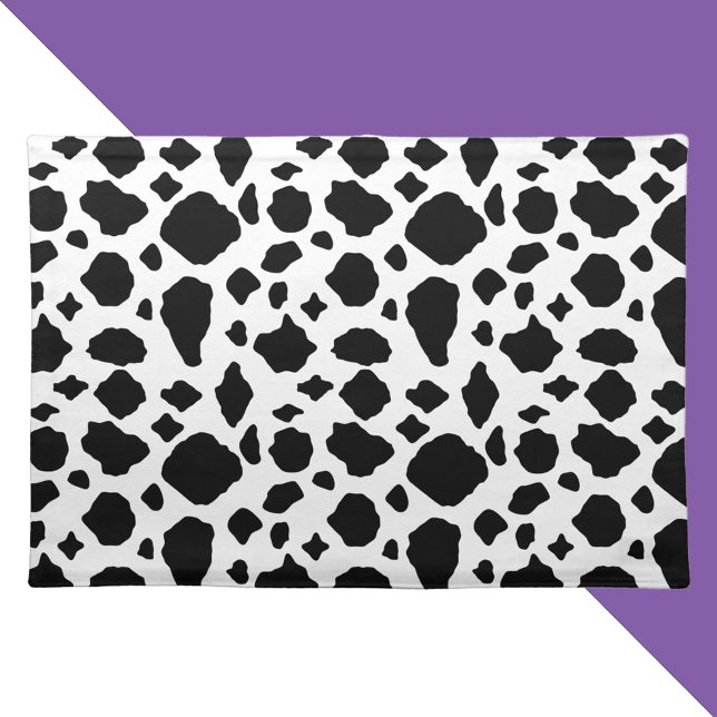Black and White Cow Pattern Cloth Placemat (A placemat with a black and white cow pattern.)