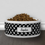 Black And White Dog Paw Pattern And Custom Name Bowl<br><div class="desc">White dog paw print pattern on a black background color. There is also a personalizable text area for a name.</div>