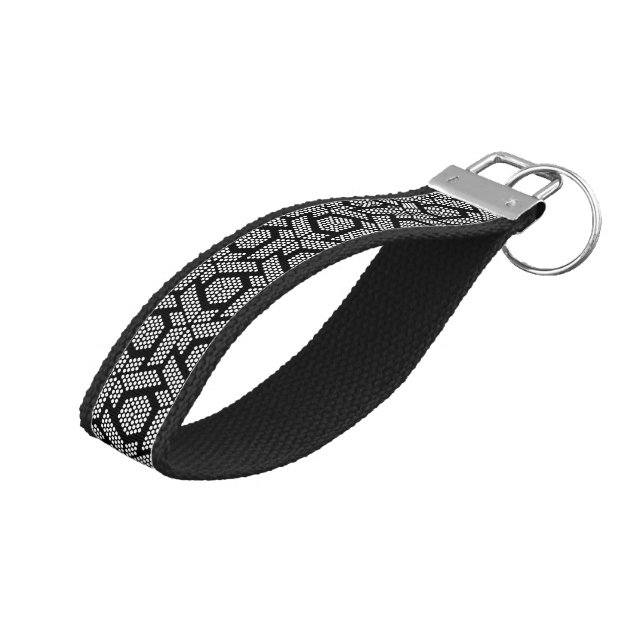 Black and white dotted geometric pattern wrist keychain (Angled Up)