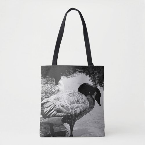 Black and White Geese Quiet Moment by the Lake Tote Bag