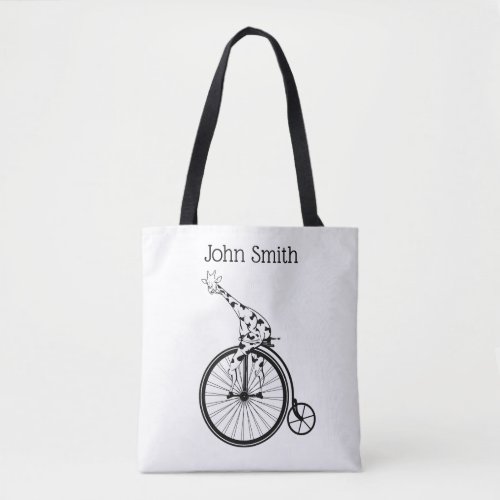 Black and white giraffe riding a bike tote bag