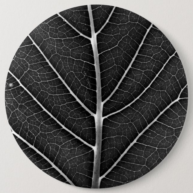 Black and white glowing leaf close-up button (Front)