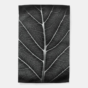 Black and white glowing leaf close-up garden flag
