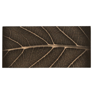 Black and white glowing leaf close-up wood flash drive