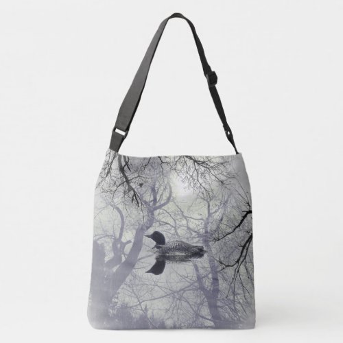 Black and white loon on a lake Cross Bag