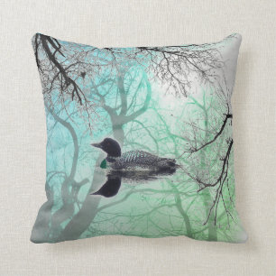Black and white loon on a lake decor pillow green