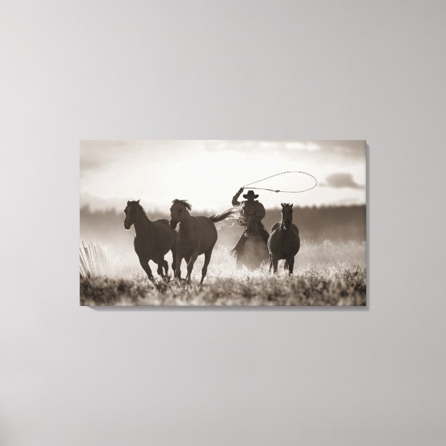 Black and White photo of a Cowboy Lassoing Horses Canvas Print (Front)